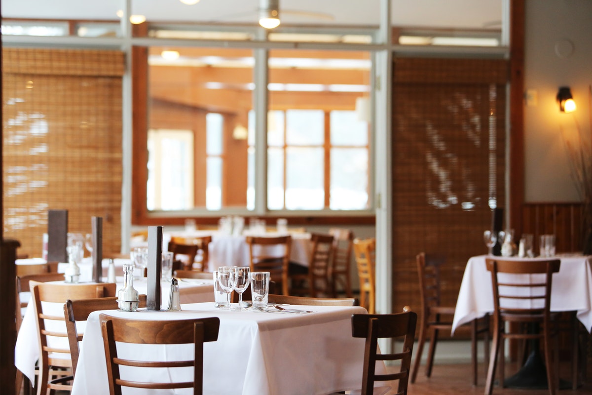 inside of restaurant dining room without customers