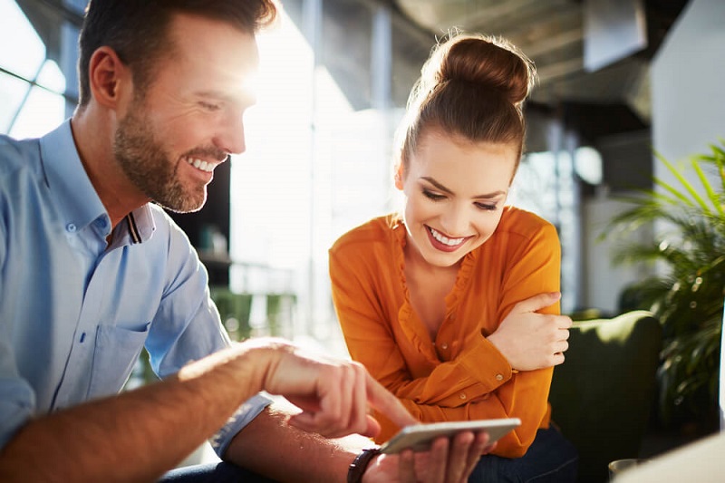 Man and woman looking at phone