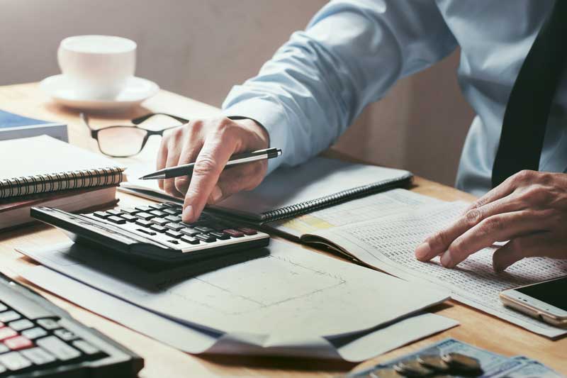Man working on financial statement reporting